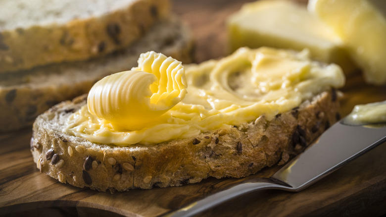 butter spread on multigrain bread