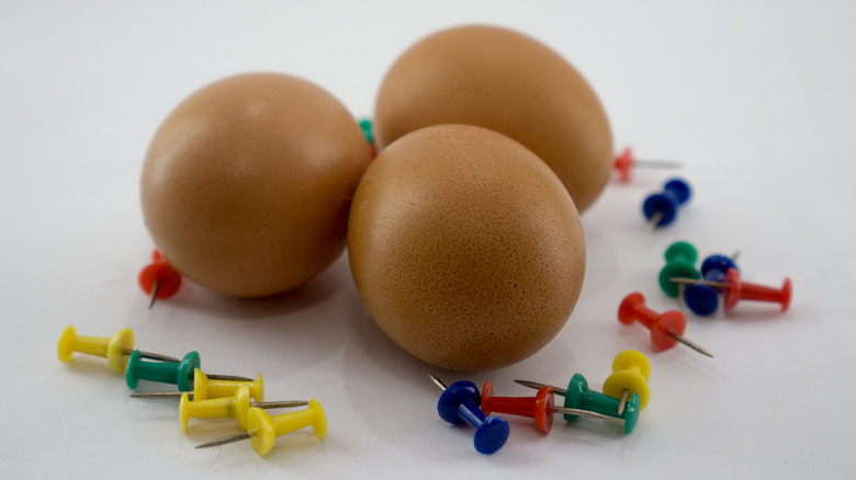 Eggs and thumbtacks 