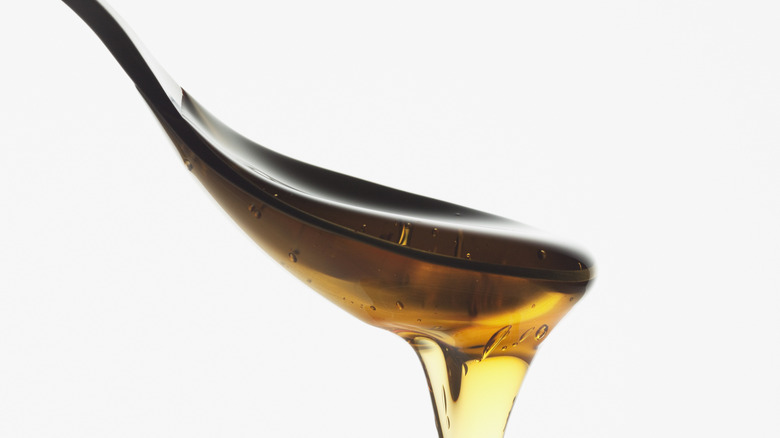 honey on a metal spoon