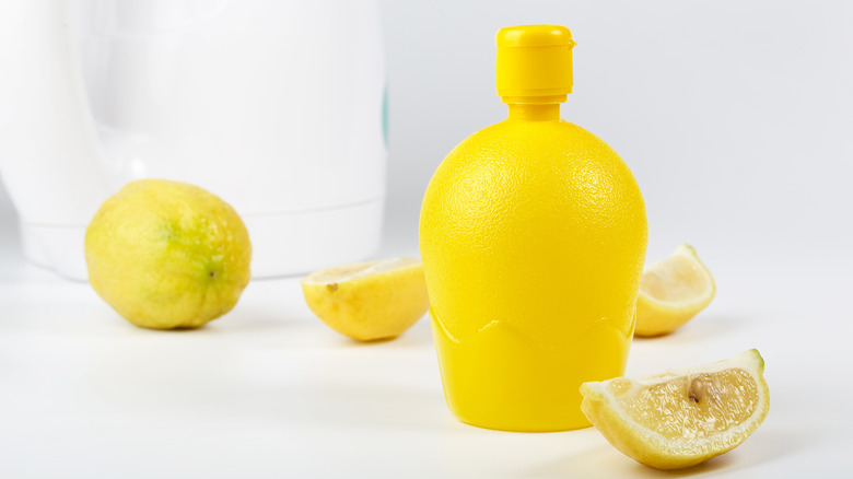 bottled lemon juice with lemons