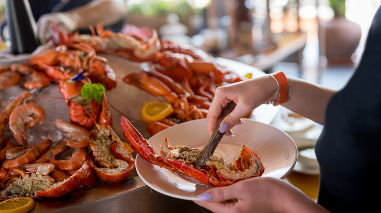 Woman eating lobster