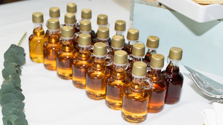 bottles of golden, amber, and dark maple syrup