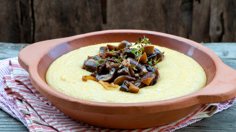 Mushrooms in polenta in a ceramic pot