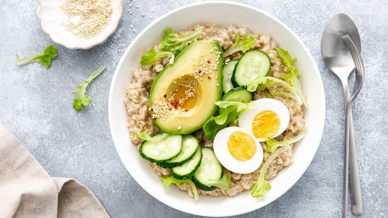 Oatmeal with eggs, cucumber, avocado