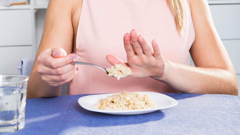 Woman disgusted by oatmeal