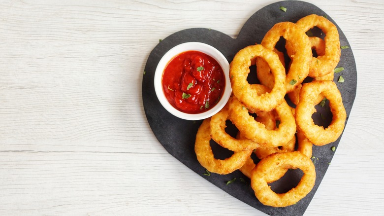 heart-shaped plate of onion rings