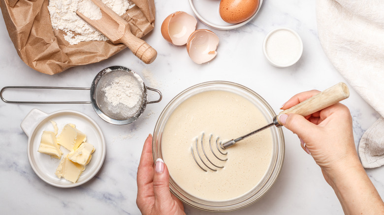 person mixing pancake batter