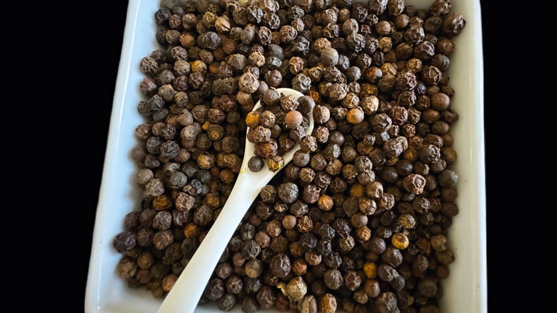 peppercorns on white plate