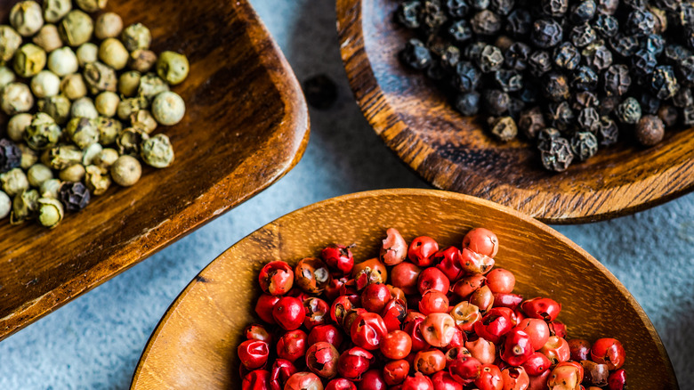 bowls of various types of peppercorns