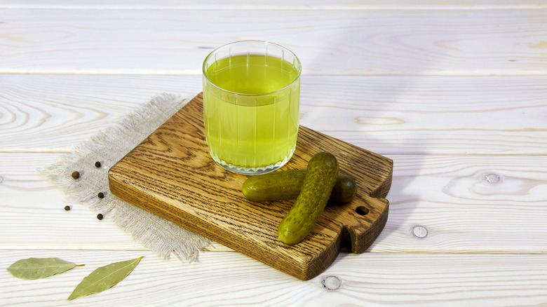 pickle juice glass with pickles