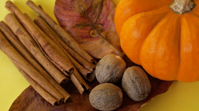 cinnamon sticks, whole nutmeg, and pumpkin