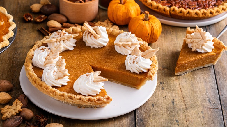 pumpkin pie on a wooden table