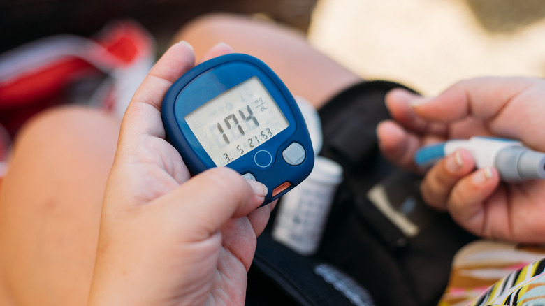 Diabetic person checking blood sugar