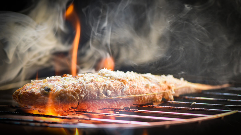 whole salted fish on grill