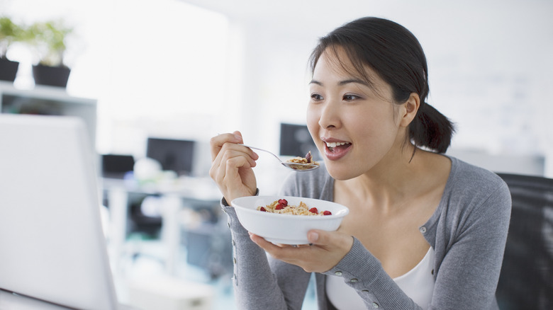 Woman eating cereal