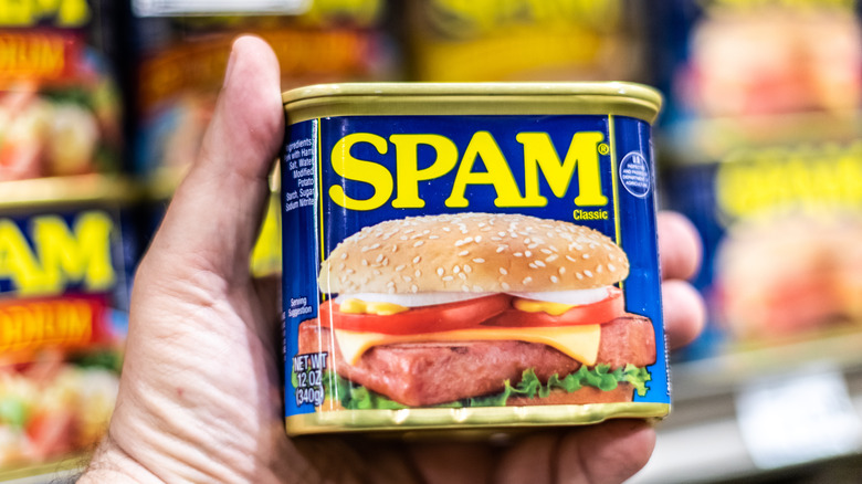 holding a can of spam