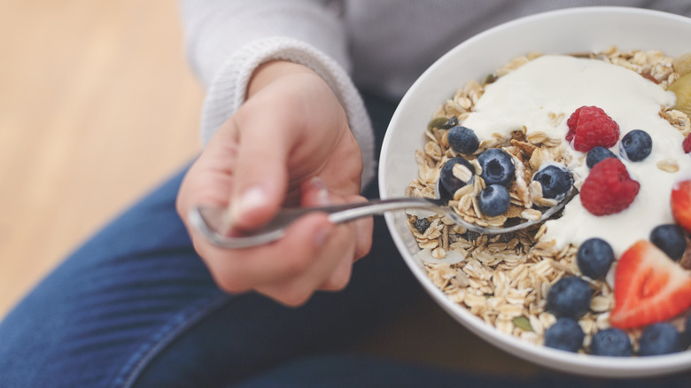 bowl of yogurt, granola and berries