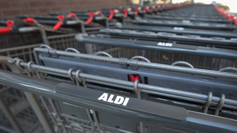 Line of black Aldi shopping carts