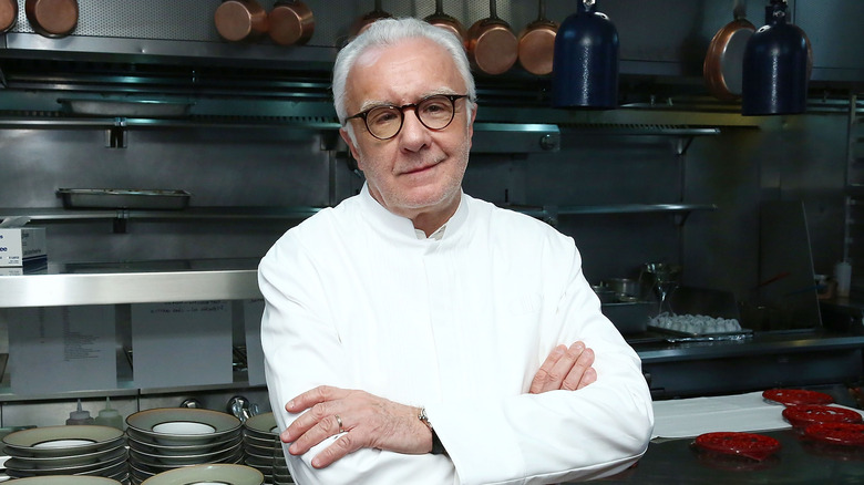 alain ducasse standing in the kitchen