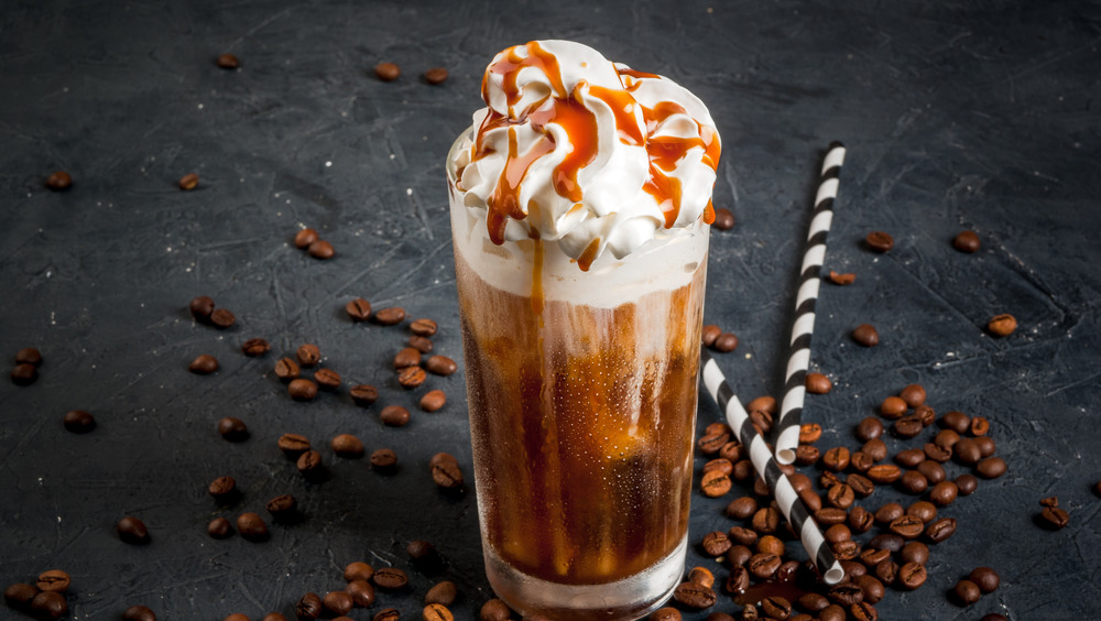 Iced coffee with whipped cream and syrup