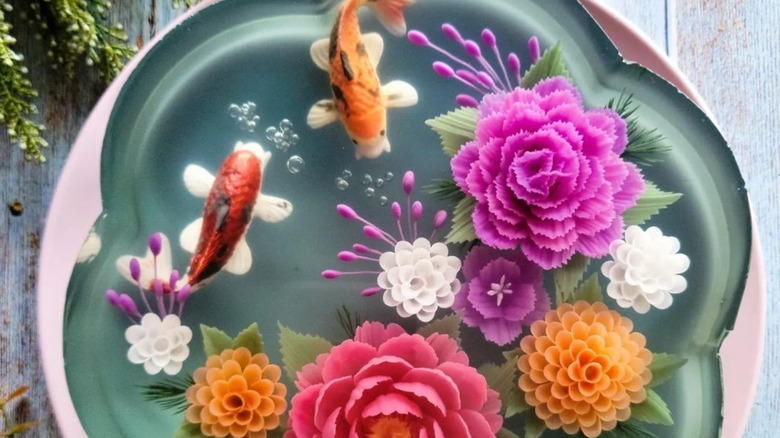 Gelatin cake with 3D, colorful flowers and fish inside.