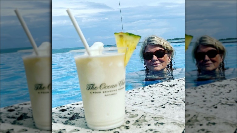 Martha Stewart swimming toward drink