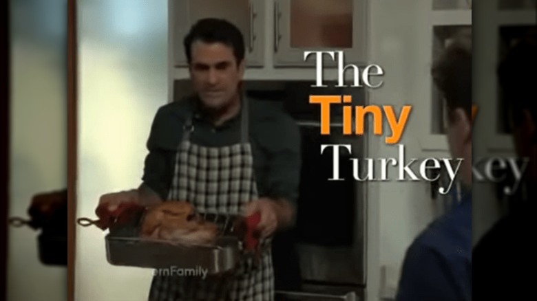 Modern Family's Phil with a tiny turkey. 