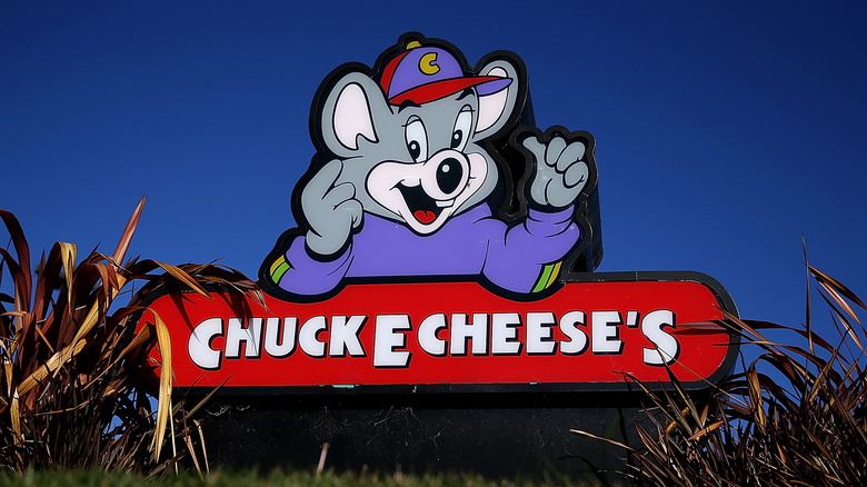 Chuck E. Cheese's sign in grass