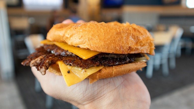 Hand holding Culver's cheeseburger