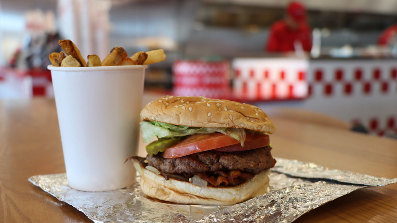 Five Guys burger on foil