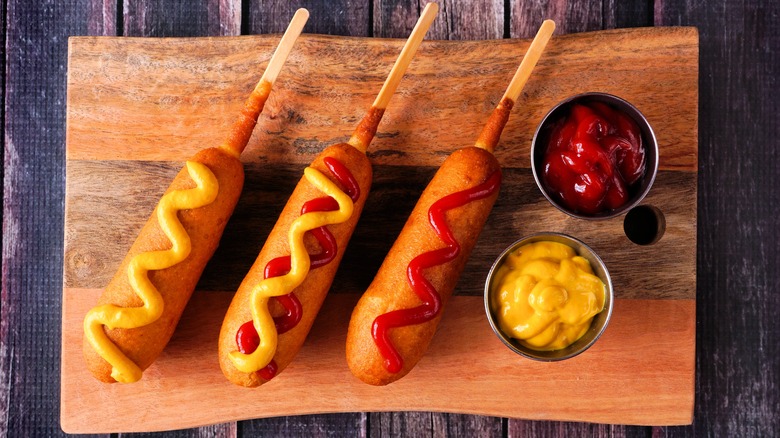 corn dogs on a cutting board