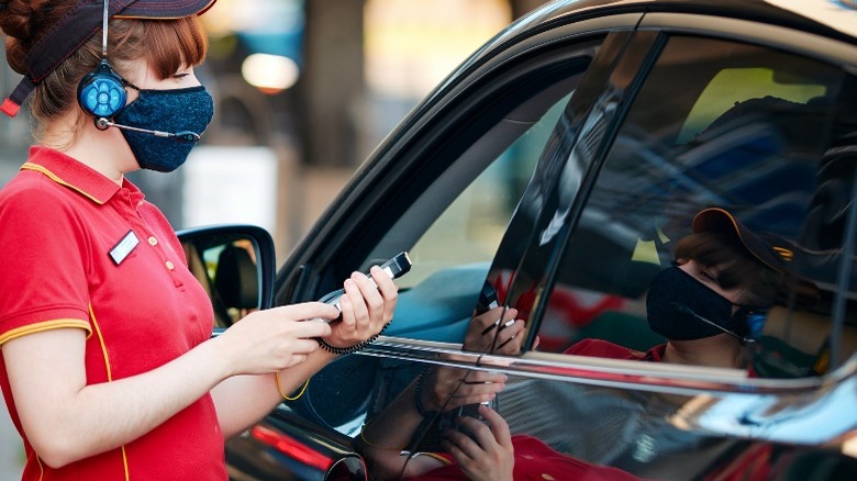 Person taking orders in drive-thru