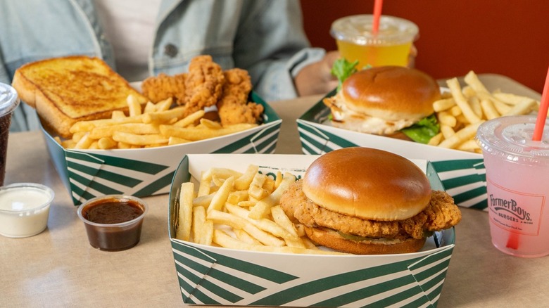 Farmer Boys meals in boxes are displayed at a table.