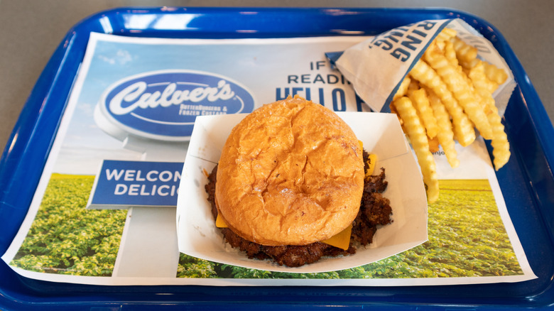 Culver's burger and fries sit on a tray at the restaurant.