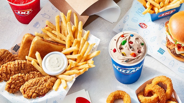 Assorted menu items from Dairy Queen include fries, chicken, a Blizzard, and a burger.