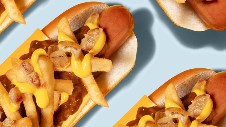 Wienerschnitzel's Junkyard Dog is topped with fries, mustard, cheese, and chili.