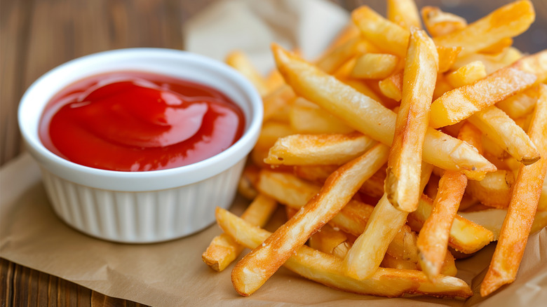 French fries with a side of ketchup