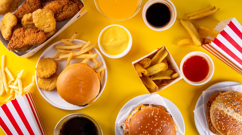 Generic fast food items are displayed on a yellow background.