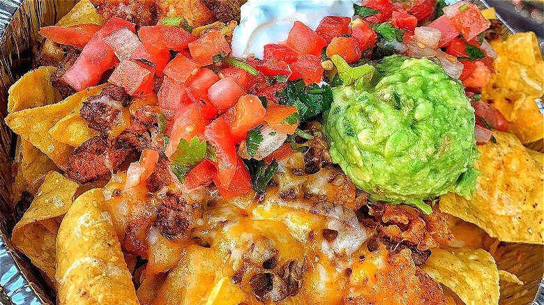 Nachos with scoop of guacamole