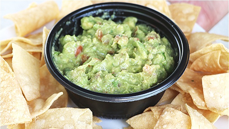 Chips with guacamole in cup