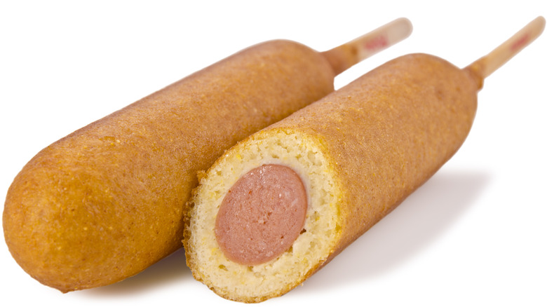 Pair of corn dogs on white