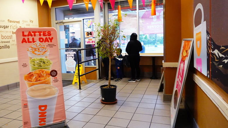 Customers waiting in Dunkin' restaurant