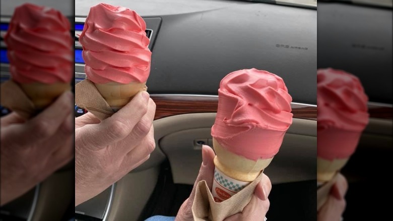 Two Rally's Wicked Strawberry Cone in a car