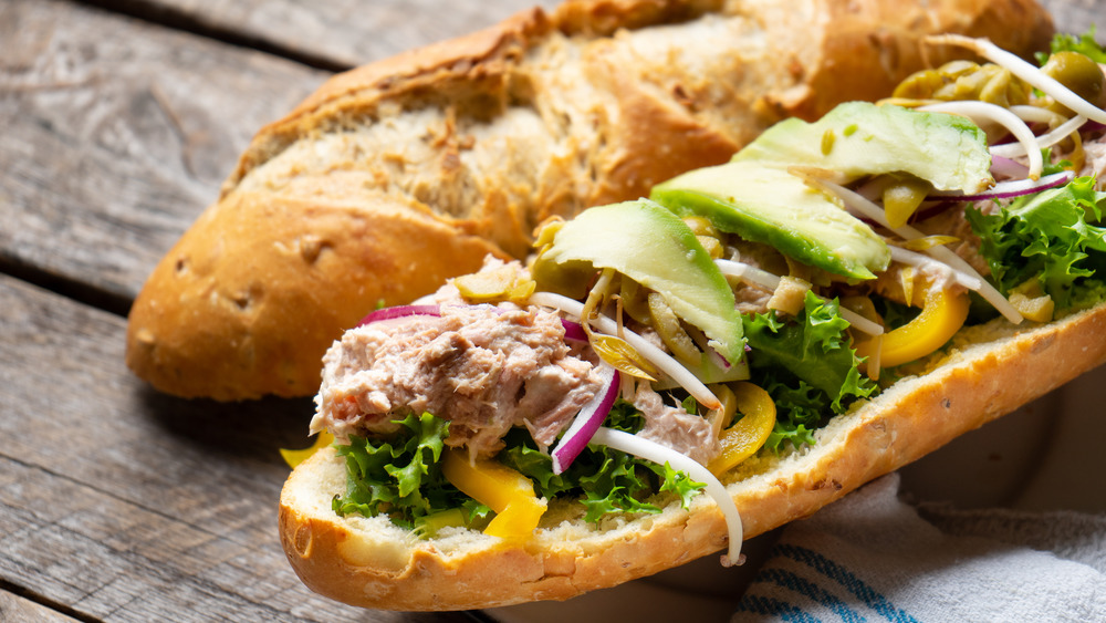 Tuna salad sub on wood