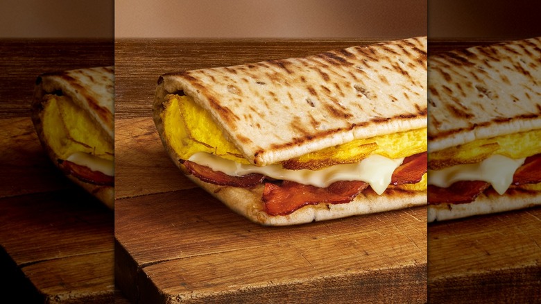 Sandwich with eggs, cheese, and bacon