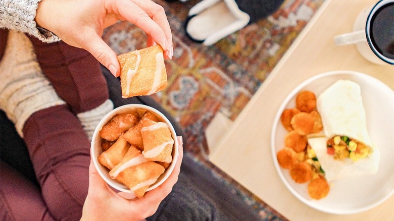 Holding Mexican Donut Bites order