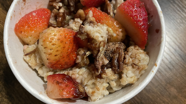 A cup of Panera's Steel-Cut Oatmeal with strawberries, pecans, and cinnamon sugar crunch