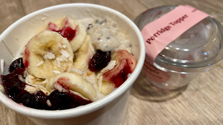 Pret's Creamy Porridge from Pret A Manger, topped with a Coconut Banana Blueberry Topper