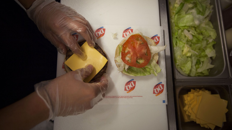 Dairy Queen employee making burger