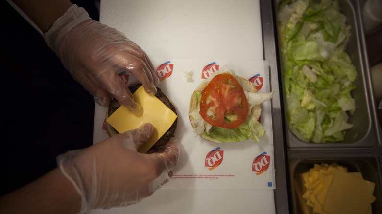 Dairy Queen employee making burger